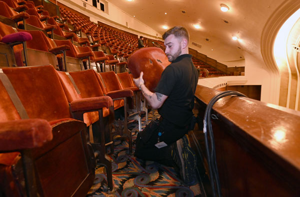 Workman removing the seating in the Opera House